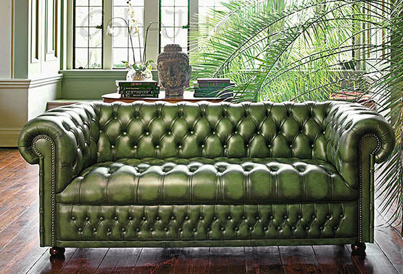 Кожаный тёмно-зелёный диван